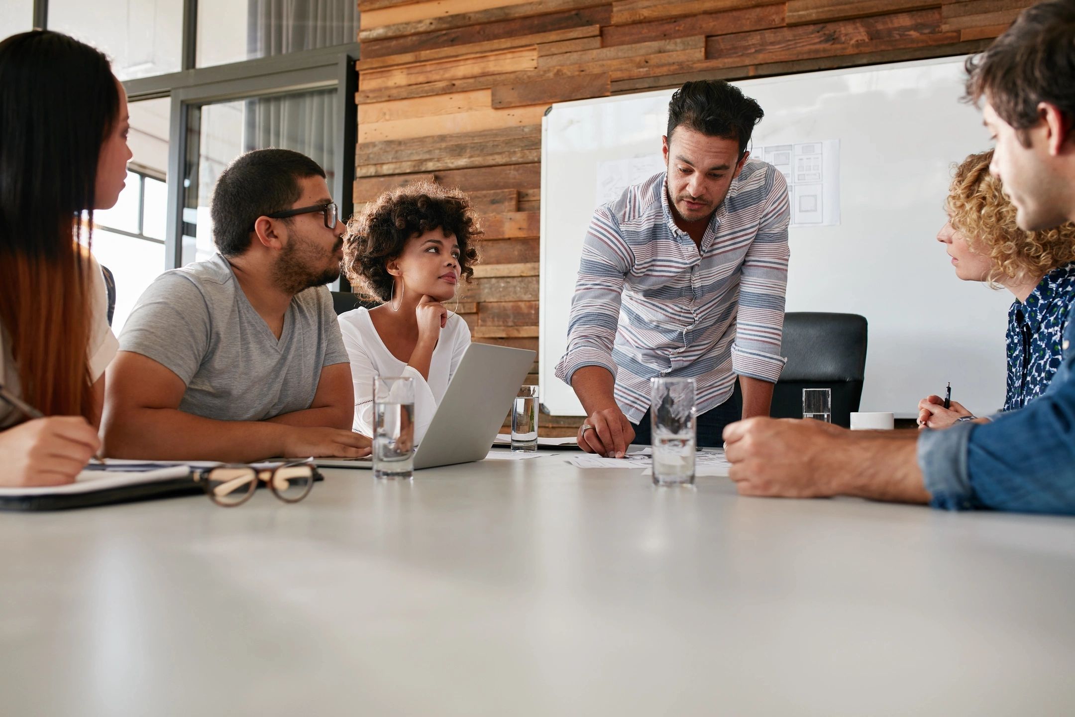 business-team-working-conference-room-wood-wall